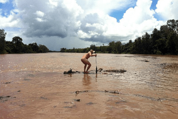 naked-man-braves-crocodile-infested-waters-for-bet_582_389